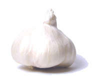 Garlic has long been credited with providing and prolonging physical strength and was fed to Egyptian slaves building the giant pyramids. Throughout the centuries, its medicinal claims have included cures for toothaches, consumption, open wounds and evil demons. A member of the lily family, garlic is a cousin to leeks, chives, onions and shallots. The edible bulb or "head" grows beneath the ground. This bulb is made up of sections called cloves, each encased in its own parchmentlike membrane. Today's major garlic suppliers include the United States (mainly California, Texas and Louisiana), France, Spain, Italy and Mexico. There are three major types of garlic available in the United States: the white-skinned, strongly flavored American garlic; the Mexican and Italian garlic, both of which have mauve-colored skins and a somewhat milder flavor; and the Paul Bunyanesque, white-skinned elephant garlic (which is not a true garlic, but a relative of the leek), the most mildly flavored of the three. Depending on the variety, cloves of American, Mexican and Italian garlic can range from 1/2 to 1 1/2 inches in length. Elephant garlic (grown mainly in California) has bulbs the size of a small grapefruit, with huge cloves averaging 1 ounce each. It can be purchased through mail order and in some gourmet markets. Green garlic, available occasionally in specialty produce markets, is young garlic before it begins to form cloves. It resembles a baby leek, with a long green top and white bulb, sometimes tinged with pink. The flavor of a baby plant is much softer than that of mature garlic. Fresh garlic is available year-round. Purchase firm, plump bulbs with dry skins. Avoid heads with soft or shriveled cloves, and those stored in the refrigerated section of the produce department. Store fresh garlic in an open container (away from other foods) in a cool, dark place. Properly stored, unbroken bulbs can be kept up to 8 weeks, though they will begin to dry out toward the end of that time. Once broken from the bulb, individual cloves will keep from 3 to 10 days. Garlic is usually peeled before use in recipes. Among the exceptions are roasted garlic bulbs and the famous dish, "chicken with 40 cloves of garlic," in which unpeeled garlic cloves are baked with chicken in a broth until they become sweet and butter-soft. Crushing, chopping, pressing or pureeing garlic releases more of its essential oils and provides a sharper, more assertive flavor than slicing or leaving it whole. Garlic is readily available in forms other than fresh. Dehydrated garlic flakes (sometimes referred to as instant garlic) are slices or bits of garlic that must be reconstituted before using (unless added to a liquid-based dish, such as soup or stew). When dehydrated garlic flakes are ground, the result is garlic powder. Garlic salt is garlic powder blended with salt and a moisture-absorbing agent. Garlic extract and garlic juice are derived from pressed garlic cloves. Though all of these products are convenient, they're a poor flavor substitute for the less expensive, readily available and easy-to-store fresh garlic. One unfortunate side effect of garlic is that, because its essential oils permeate the lung tissue, it remains with the body long after it's been consumed, affecting breath and even skin odor. Chewing chlorophyll tablets or fresh parsley is helpful but, unfortunately, modern-day science has yet to find the perfect antidote for residual garlic odor.