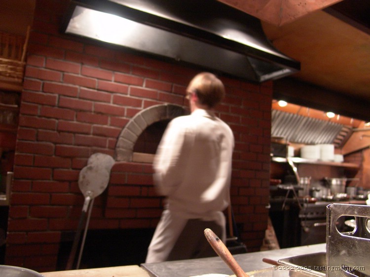 14 putting a pizza in the brick oven.jpg